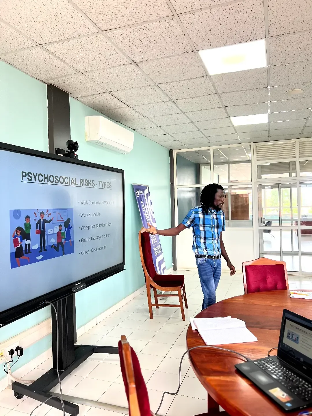 KAWEKWA Douglas, Founder of MindLyfe, delivers a professional presentation at the National ICT Hub